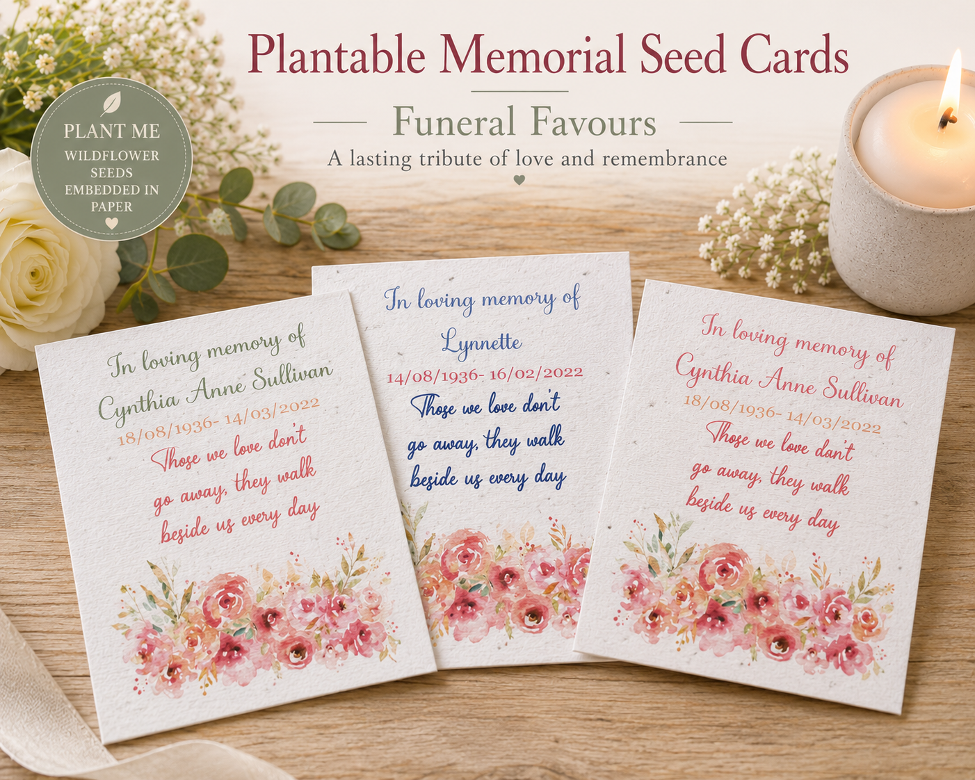 Three plantable memorial seed cards displayed on a wooden surface with a lit candle, flowers, and greenery. The cards feature floral designs and customizable text for remembrance messages.